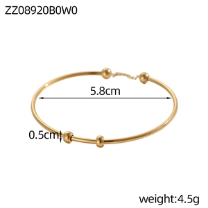 Vista dettagliata del bracciale a scorrimento in acciaio dorato con dimensioni e peso