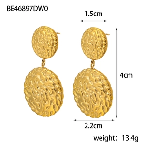 Detailed view of gold geometric earrings with hammered texture and measurement dimensions
