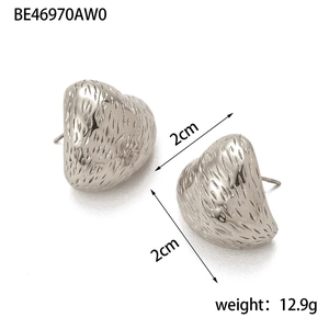 Detailed view of silver heart earrings with textured finish, size 2cm and weight 12.9g