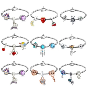 Detail showing nine styles of DIY charm bracelets with snake chains and themed pendants