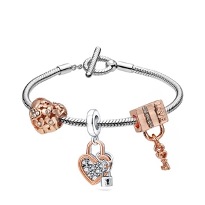 Silver snake chain bracelet with rose gold heart lock and key charms with LOVE engraving