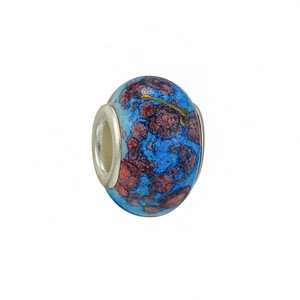 Close-up of DIY starry blue and red galaxy bead with golden sparkles and silver metal core