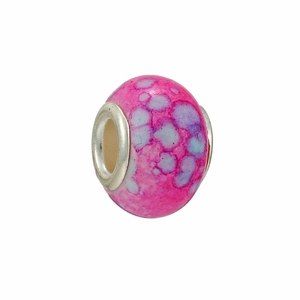Macro detail of a pink marbled DIY charm bead with a silver core for bracelets