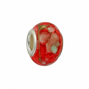 Macro shot of red marble glass charm with gold foil accents for DIY bracelets