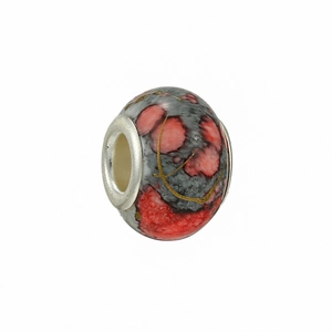 Detail of red and grey marbled ceramic charm bead with gold veins and metal core