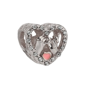 Macro shot of heart charm with paved stones, silver engraving and pink enamel heart