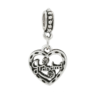 Macro shot of silver heart charm with Grandma script and delicate daisy flower details