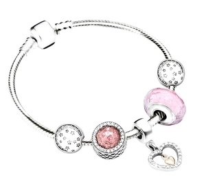 Detailed view of pink Murano glass beads and star-moon charms on a silver snake chain bracelet
