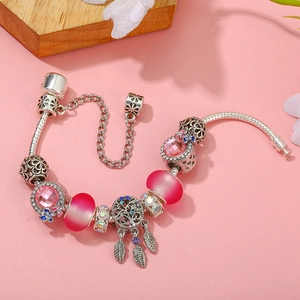 Silver snake chain bracelet with pink glass beads and dreamcatcher tree pendant