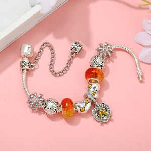 Silver Aquarius zodiac bracelet with orange glass beads and golden cup heart charm