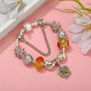 Aquarius zodiac charm bracelet with amber beads and heart charms on a silver snake chain