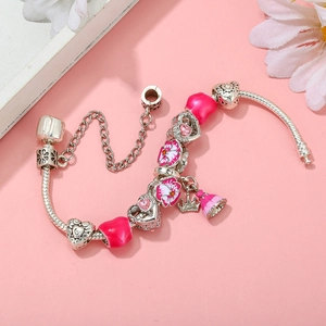 Silver snake chain bracelet with pink enamel beads and crown princess charm