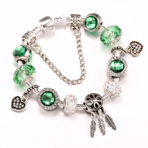 Silver snake chain bracelet with green faceted beads and heart dreamcatcher charms
