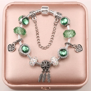 Silver snake chain bracelet with green crystal beads and heart dreamcatcher charms