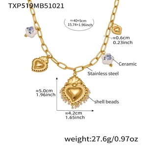 Detail of 18k gold plated necklace featuring ceramic flower and shell bead heart charms
