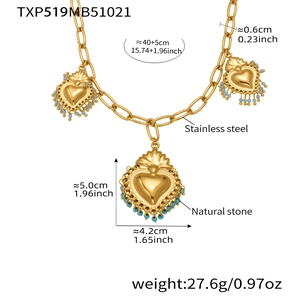 Detailed macro view of gold stainless steel heart charms with turquoise stone accents