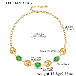 Detail of 18k gold plated stainless steel necklace with green glass stones and pig nose links