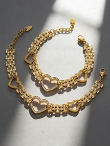 Detail of 18k gold plated stainless steel watch-link chain with zircon heart charms