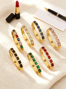 Collection of 18k gold plated stainless steel bangles with colorful rectangular crystals