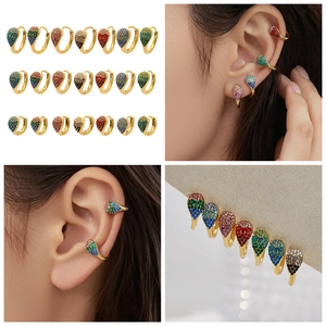 Close-up of teardrop 18k gold plated earrings featuring vibrant colorful zircon stones