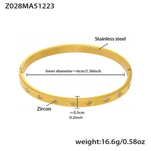 Detailed close-up of 18k gold plated stainless steel zircon bangle with geometric pattern