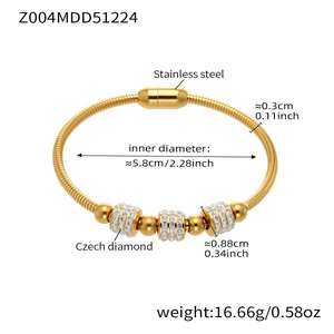 Detail of 18k gold plated snake chain bracelet with three zircon inlaid cylinders