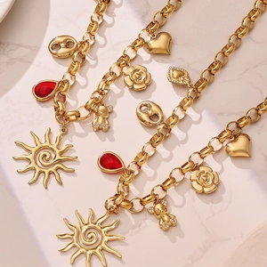 Golden sun and bear pendant necklace set with zircon accents on thick chain links