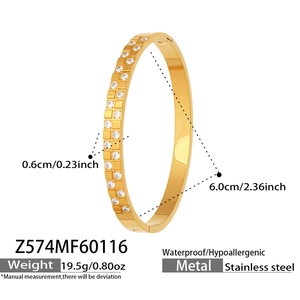 Detail of 18k gold plated checkerboard bangle with zircon inlays and stainless steel finish
