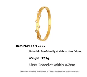 Detail of 18k gold plated stainless steel cuff featuring pear-cut zircon water droplets