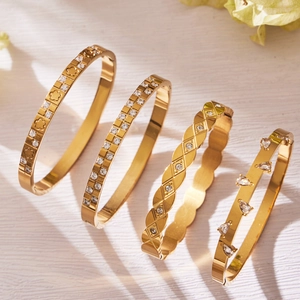 Set of 18k gold plated stainless steel bangles with geometric zircon teardrop designs