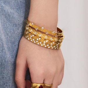 Stackable 18k gold plated stainless steel bangles with teardrop cubic zirconia accents