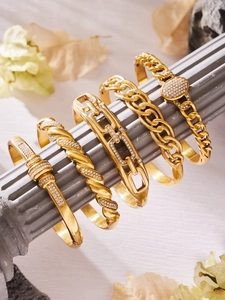 Macro shot of 18k gold plated stainless steel bracelets with sparkling zircon stones