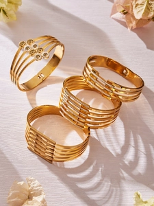 Detailansicht der hohlen mehrlagigen Gold-Edelstahlarmbänder mit Zirkonia-Inlay