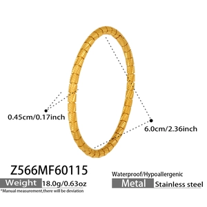Detail view of 18k gold plated stainless steel bangle with spiral texture and size data