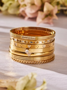 Bracciali sovrapponibili placcati oro 18k con zirconi a cuore e motivi geometrici chic