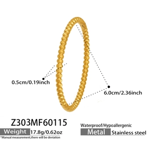 Detail view of 18k gold plated stainless steel bangle with dimensions and spiral texture