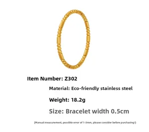 Macro view of 18k gold plated stainless steel bracelet with textured woven design
