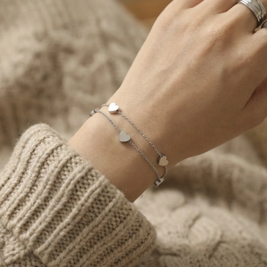Elegant double-layered silver heart bracelet for women with polished charms on a fine chain