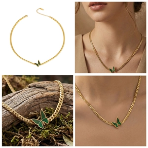 Detailed views of 18k gold plated Cuban chain necklace with green enamel butterfly pendant