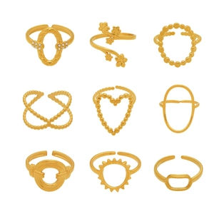 Nine-piece set of geometric heart and floral open gold rings in stainless steel
