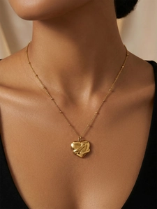 Detailed close-up of a 3D hug heart pendant necklace in gold-plated stainless steel