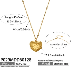Detail of 3D heart pendant necklace in gold stainless steel with adjustable bead chain