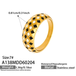 Detail of 18k gold plated stainless steel ring with black and white checkered enamel