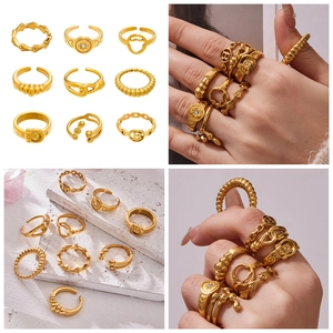 Detail view of a 9-piece gold-plated stainless steel stackable ring set with various patterns