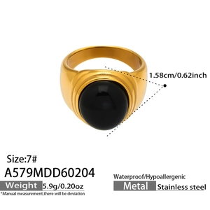 Detail showing an 18k gold-plated stainless steel ring with a large black round stone