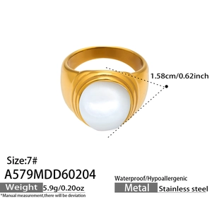 Detail view of gold stainless steel ring with large white pearl and size specifications