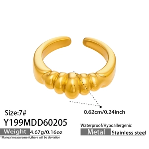 Detail view of gold croissant ring size 7 with technical measurements on white background