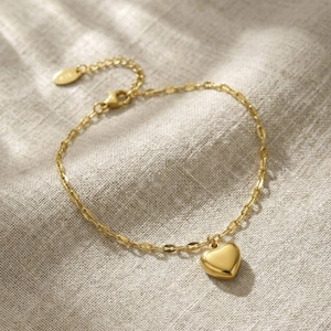 Golden stainless steel heart pendant bracelet with adjustable chain and lobster clasp