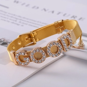 Close-up of golden mesh bracelet featuring sparkling rhinestone GOOD lettering inlay