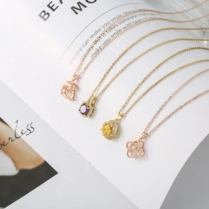Close-up of bear-shaped pendant with cubic zirconia micro-inlay on a fine chain